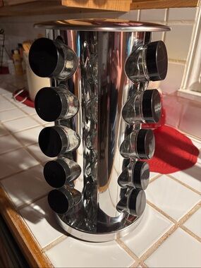 Rotating Stainless Steel Spice Rack Carousel with Black Lidded Jars
